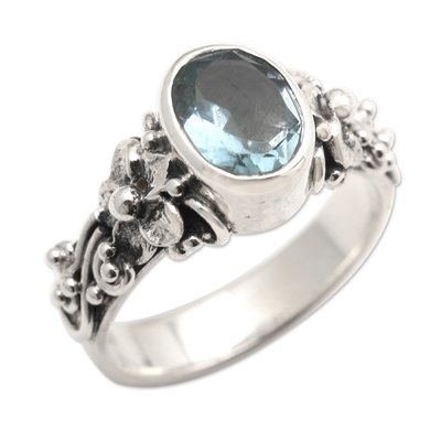 Oval Cut Blue Topaz and Silver Ring with Floral Design
