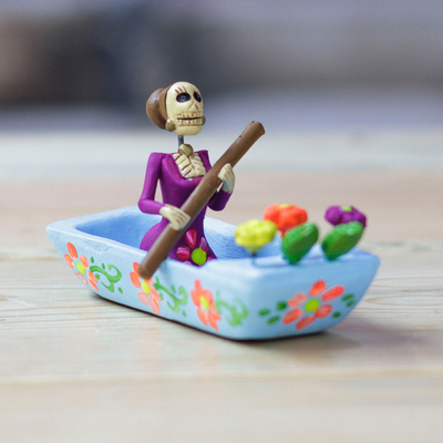Hand-Painted Catrina on a Boat Ceramic Figurine in Blue