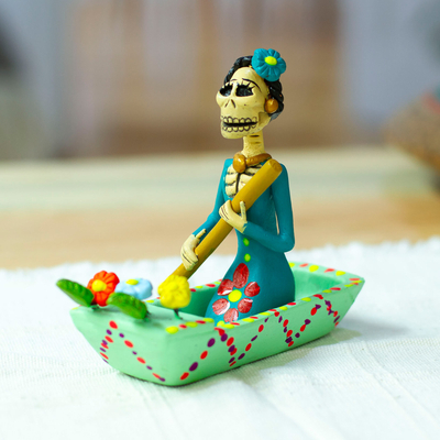 Hand-Painted Catrina on a Boat Ceramic Figurine in Mint Hues